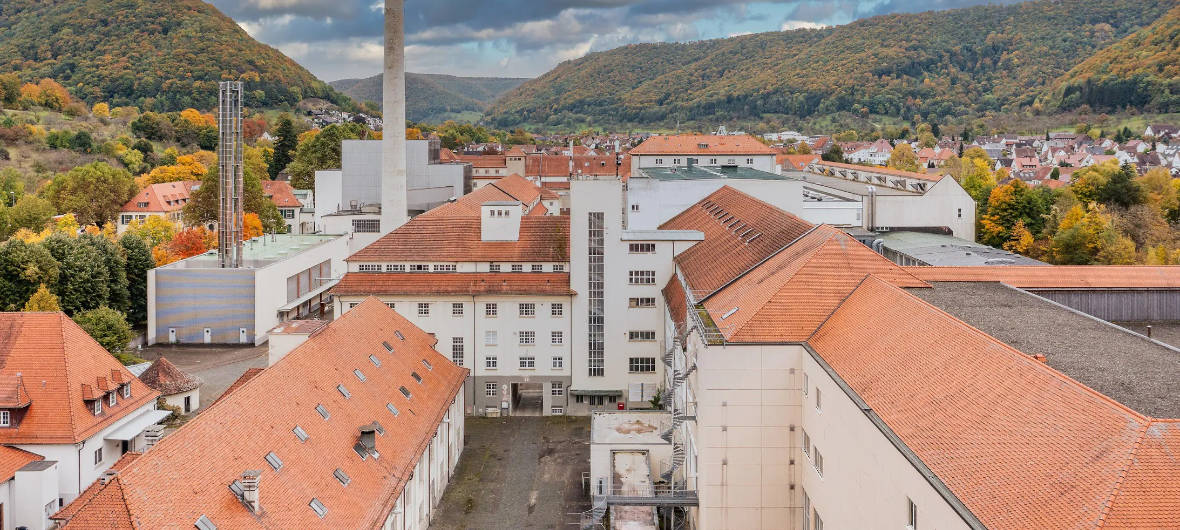 Scheufelen Quartier: Ehemalige Papierfabrik wird neuer Ortsteil für Lenningen: DLE will das Industriegelände der Scheufelen Papierfabrik in Lenningen revitalisieren und in ein urbanes Mixed-Use-Quartier umwandeln.